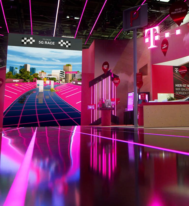 A photo of an installation with a huge portrait screen with a racing game exhibited at a Telekom trade fair booth.